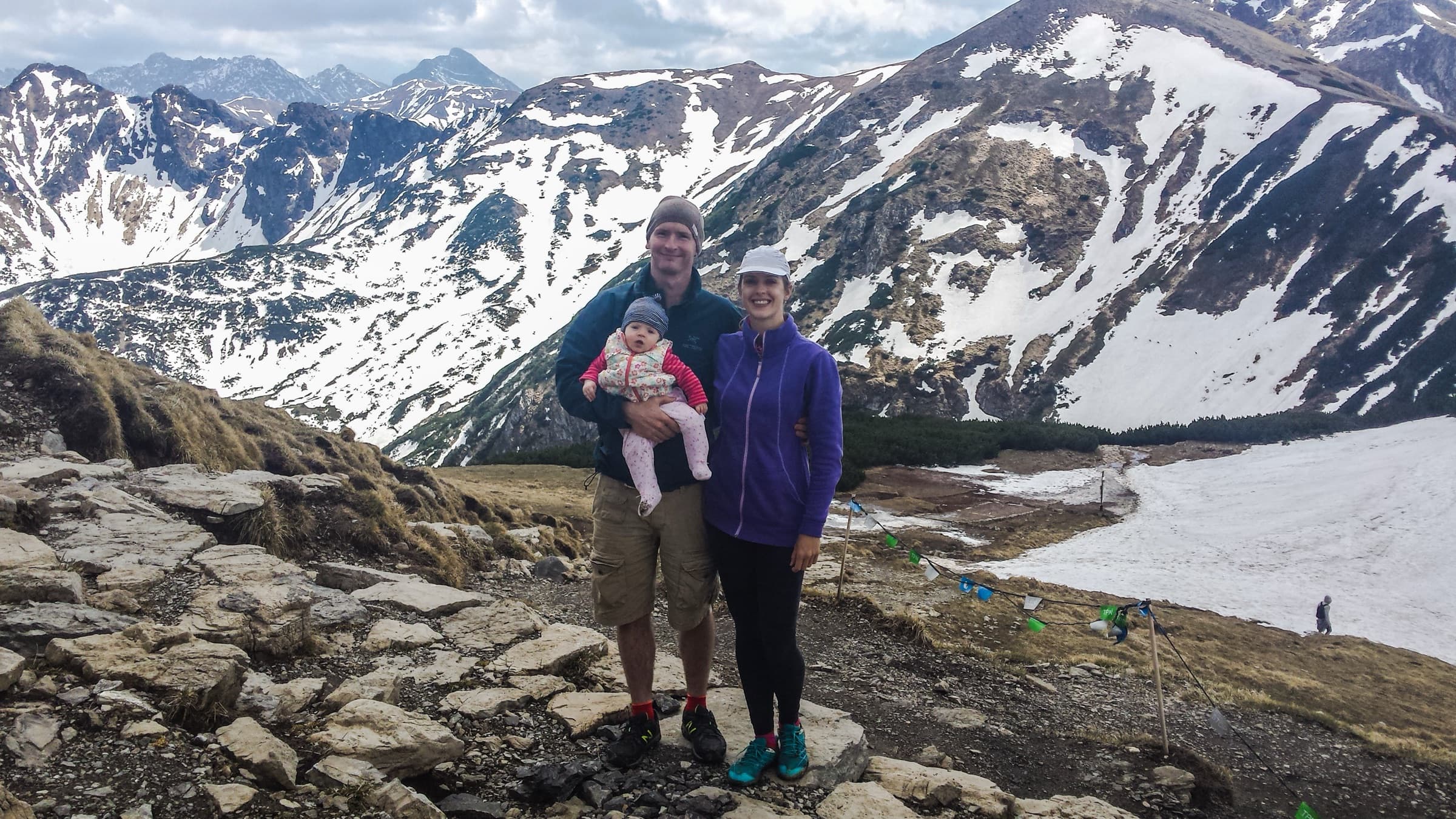 Natasha and her family on a snowy mountain summit